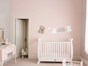 pink_nursery_feature_wall_cream_door_clothesline_artwork_white_cot_pink_carpet_dressing_table